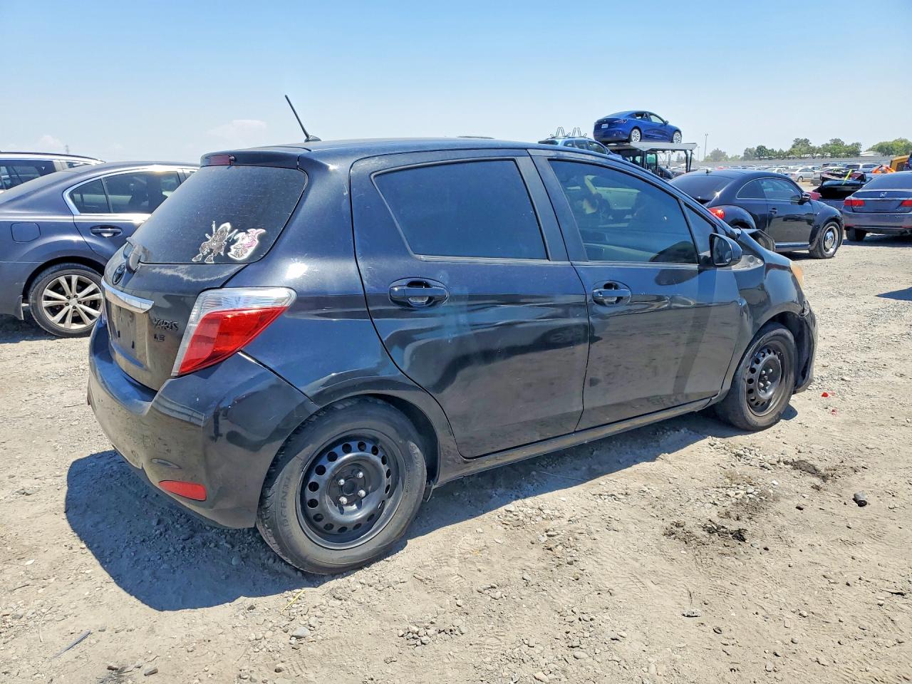 2012 Toyota Yaris 5-door Le Black vin: JTDKTUD31CD540725