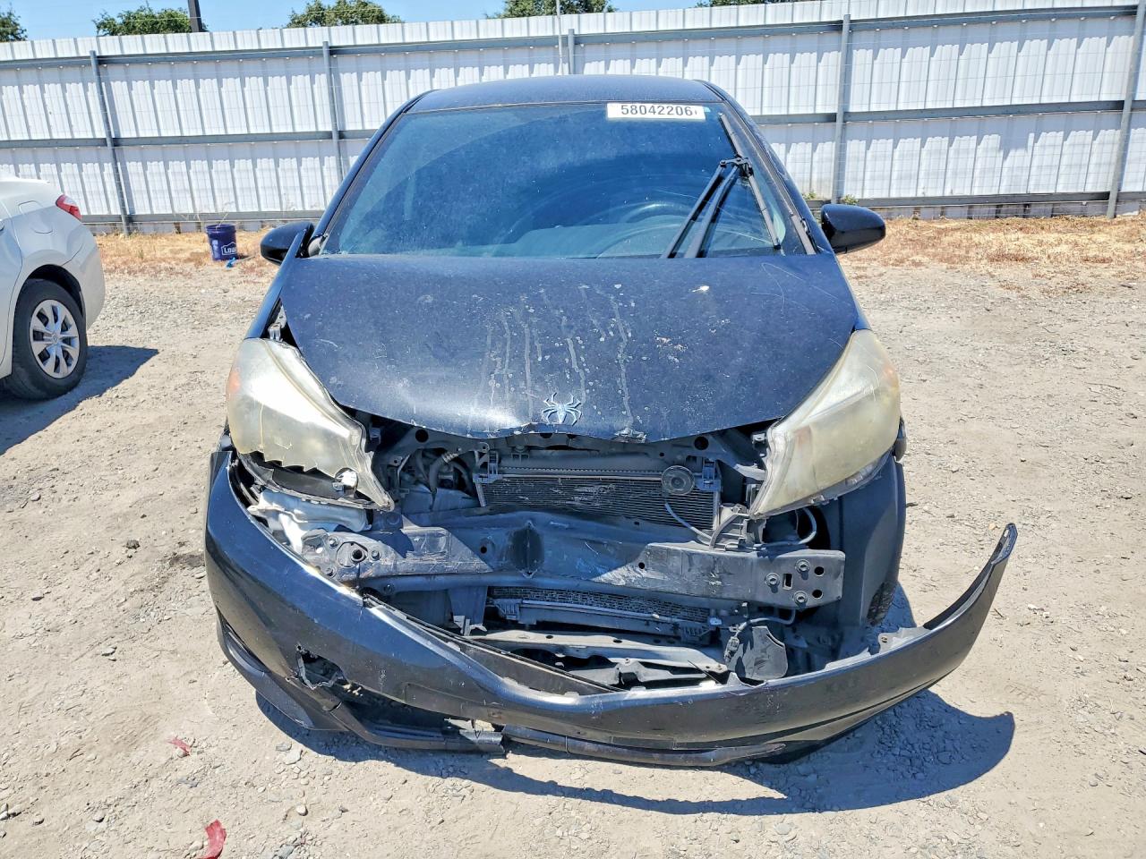 2012 Toyota Yaris 5-door Le Black vin: JTDKTUD31CD540725