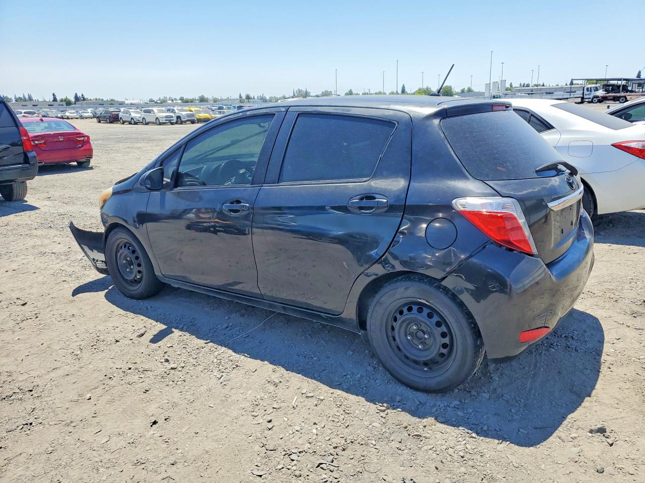 2012 Toyota Yaris 5-door Le Black vin: JTDKTUD31CD540725