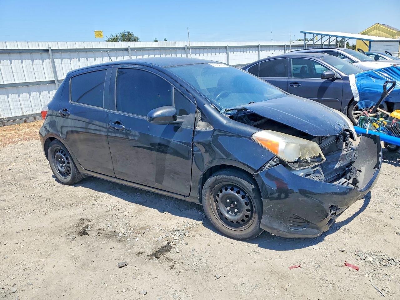 2012 Toyota Yaris 5-door Le Black vin: JTDKTUD31CD540725