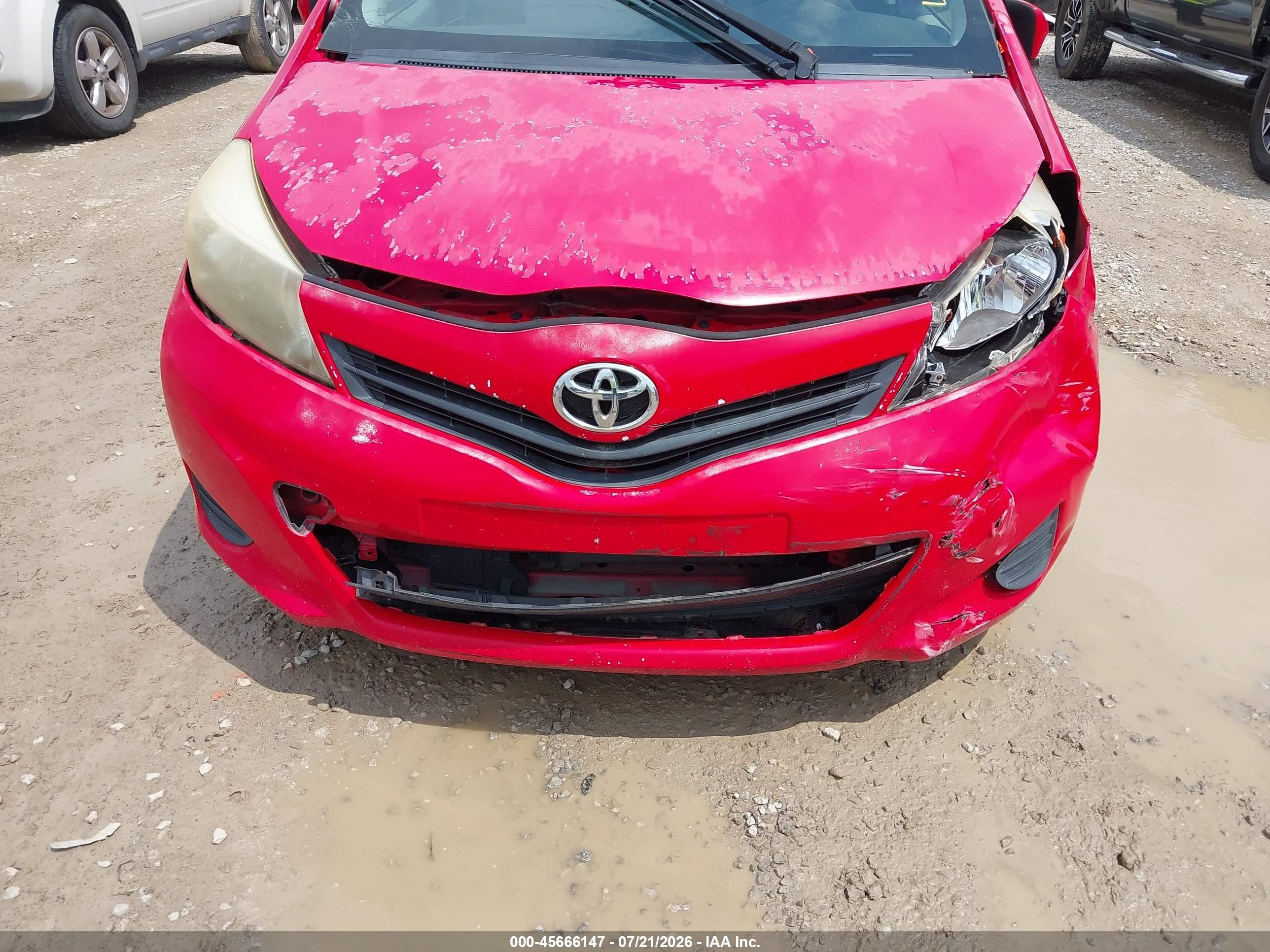 2012 Toyota Yaris L Red vin: JTDKTUD37CD523072