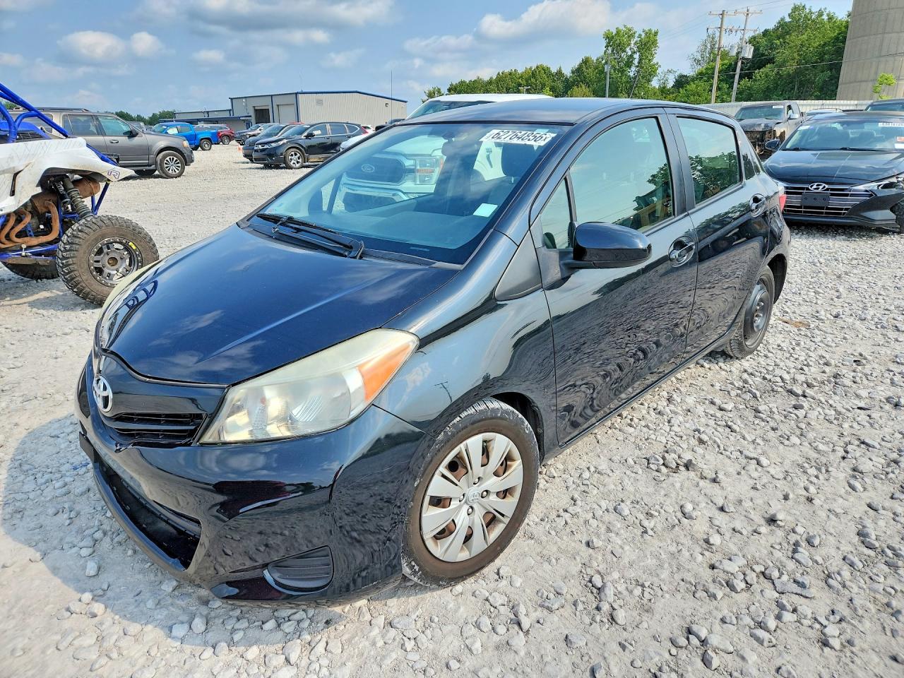 2012 Toyota Yaris 5-door Le Black vin: JTDKTUD38CD508936