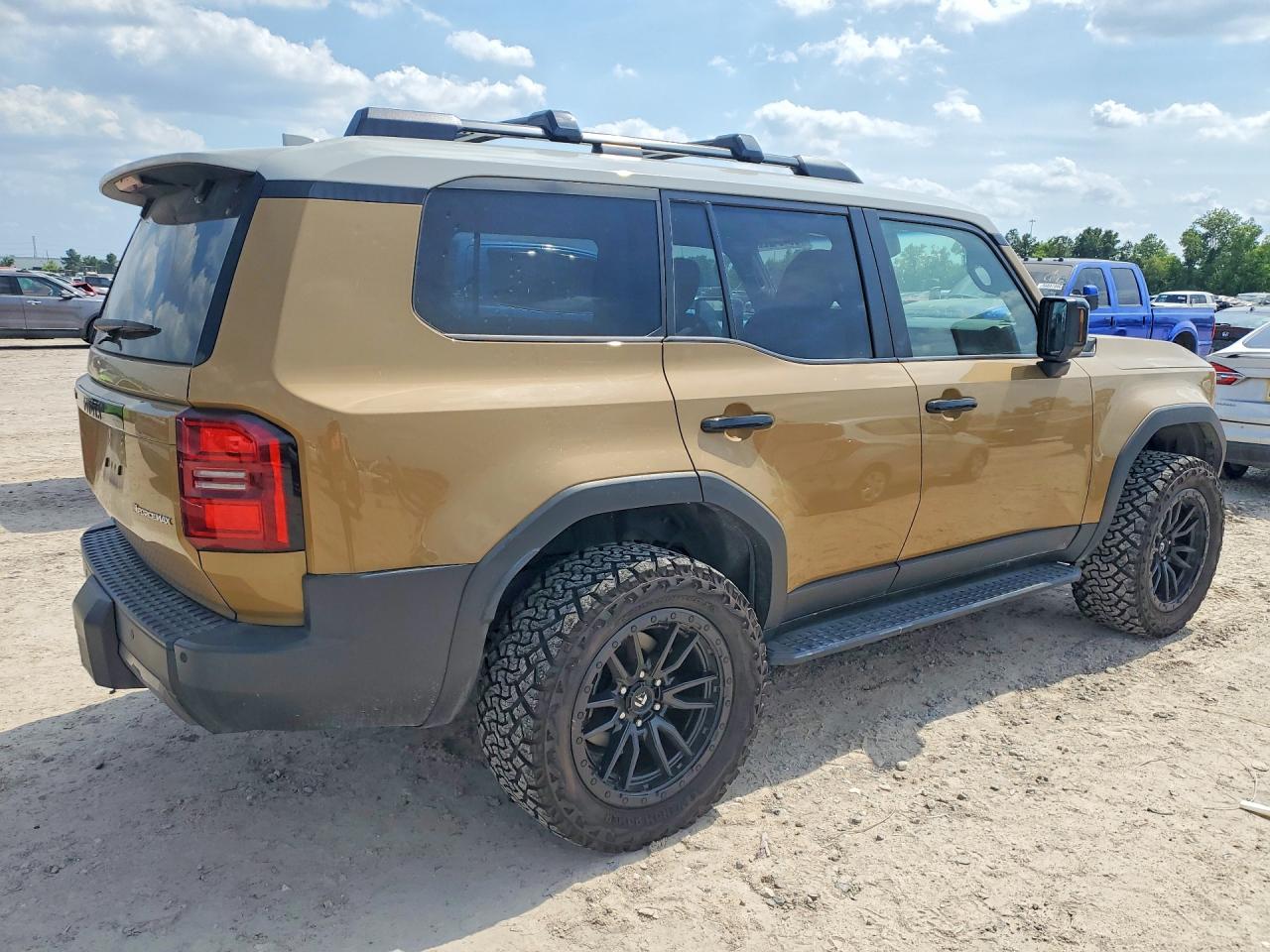 2024 Toyota Land Cruiser Base Tan vin: JTEABFAJ1RK010848