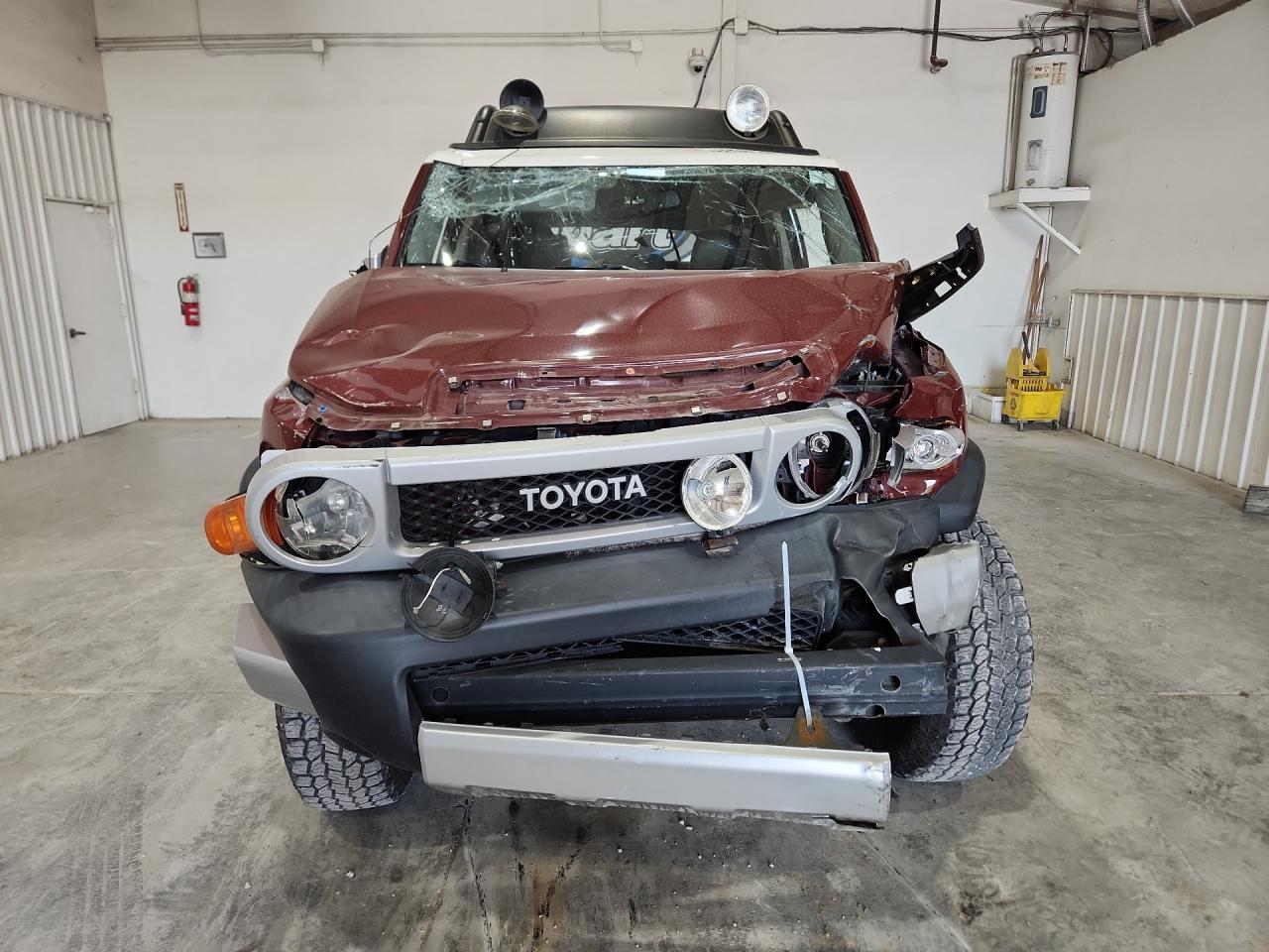 2011 Toyota Fj Cruiser Base Maroon vin: JTEBU4BF7BK105546 Damage: Front Bumper Reinforcement, Bent, > 12 Inches