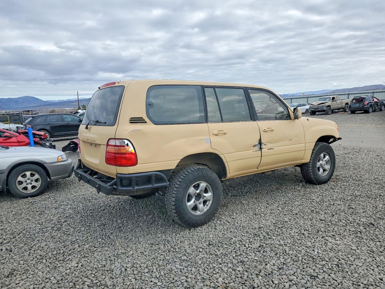 2002 Toyota Land Cruiser Base Tan vin: JTEHT05JX22028211