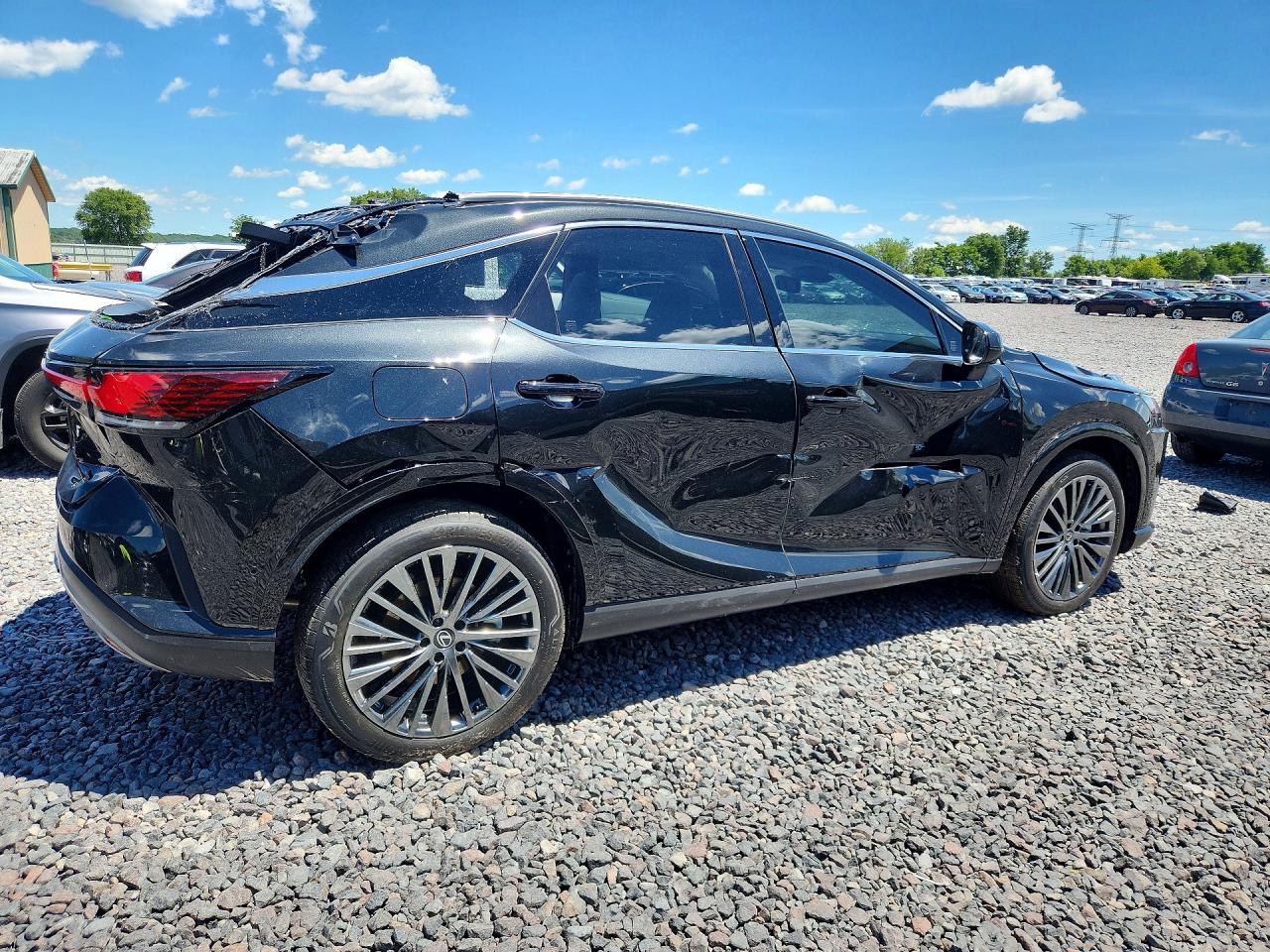 2026 Lexus Rx 450h+ Luxury Black vin: JTJCJMGA0T2037152