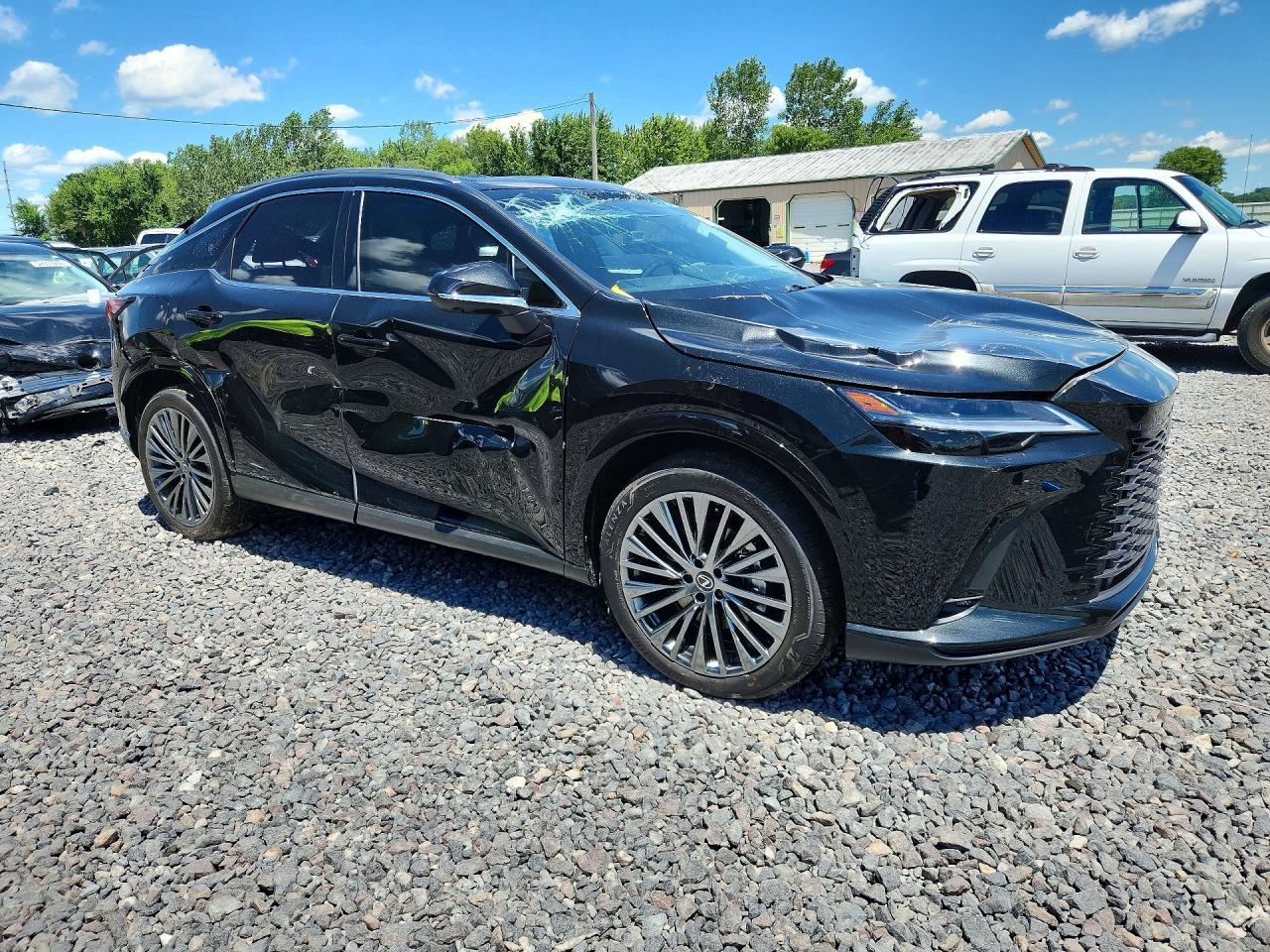 2026 Lexus Rx 450h+ Luxury Black vin: JTJCJMGA0T2037152