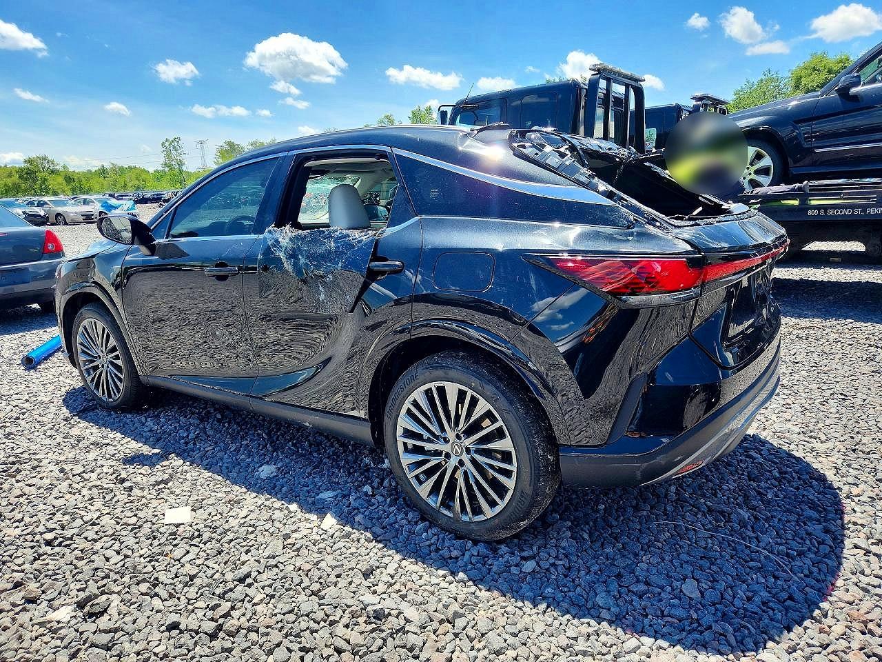 2026 Lexus Rx 450h+ Luxury Black vin: JTJCJMGA0T2037152