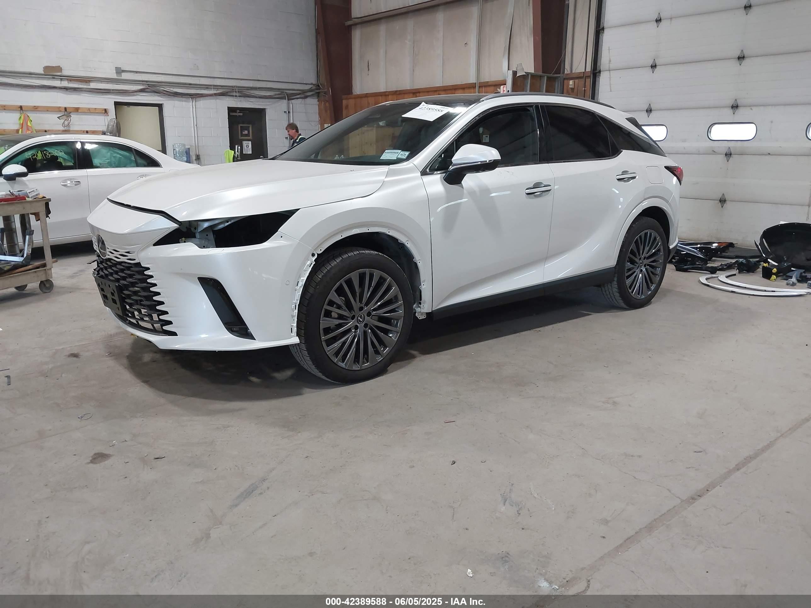 2025 Lexus Rx 450h+ Luxury White vin: JTJCJMGA6S2025585