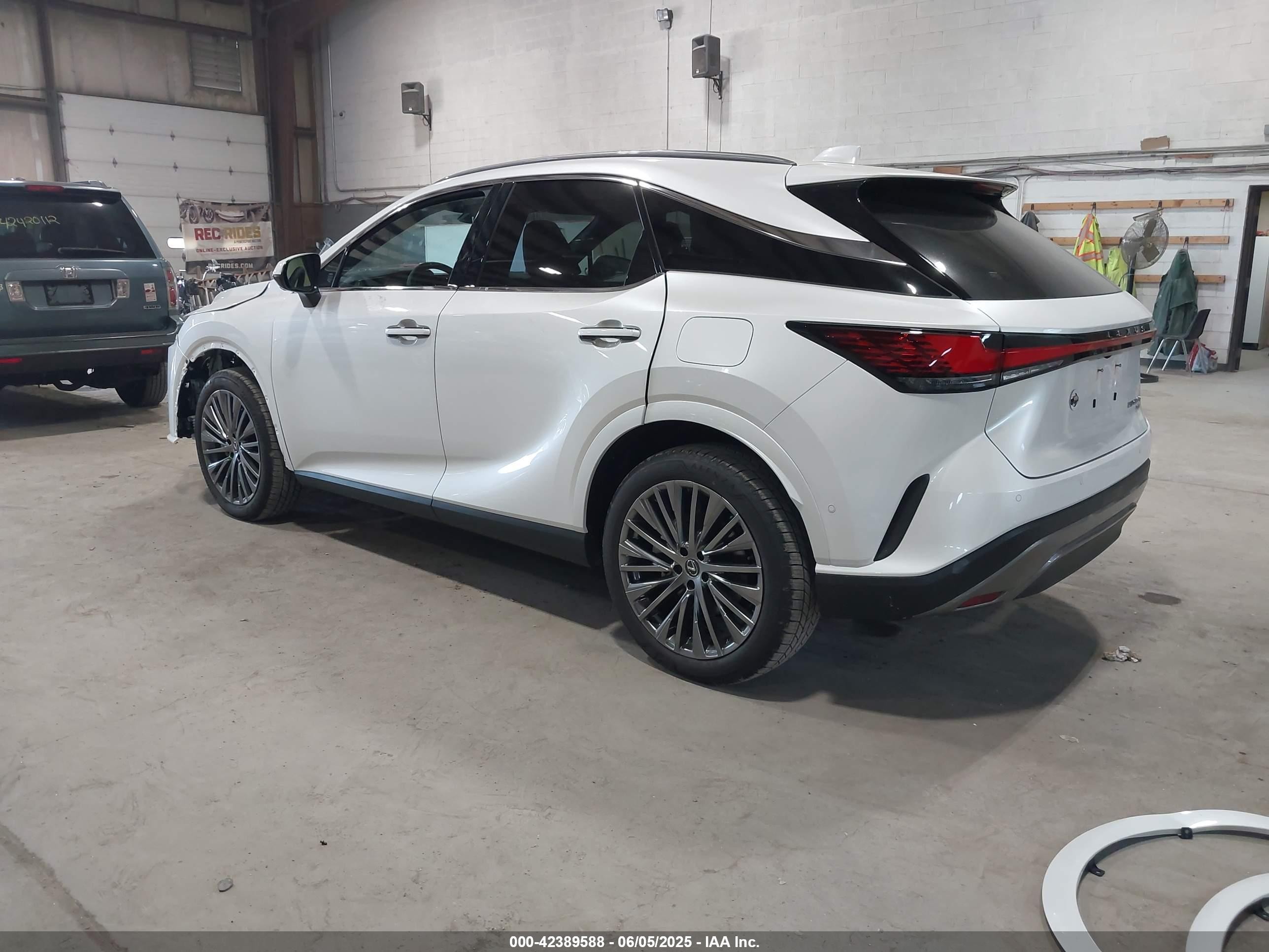 2025 Lexus Rx 450h+ Luxury White vin: JTJCJMGA6S2025585