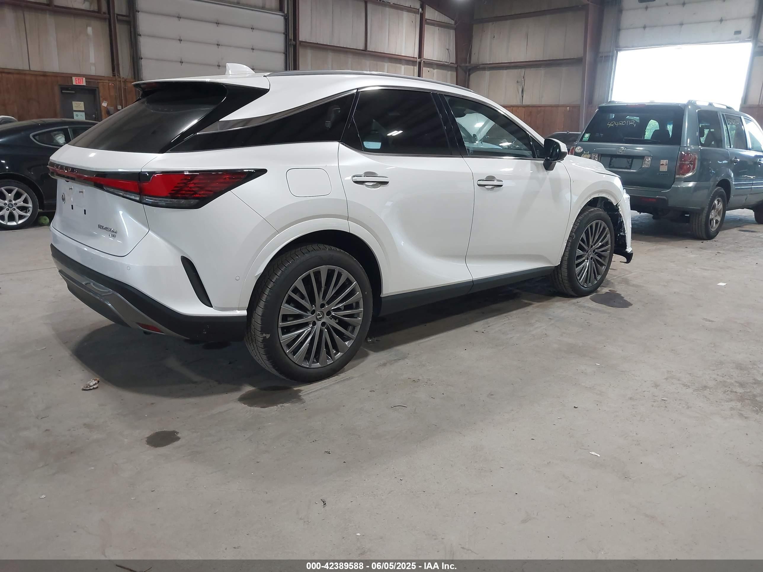 2025 Lexus Rx 450h+ Luxury White vin: JTJCJMGA6S2025585