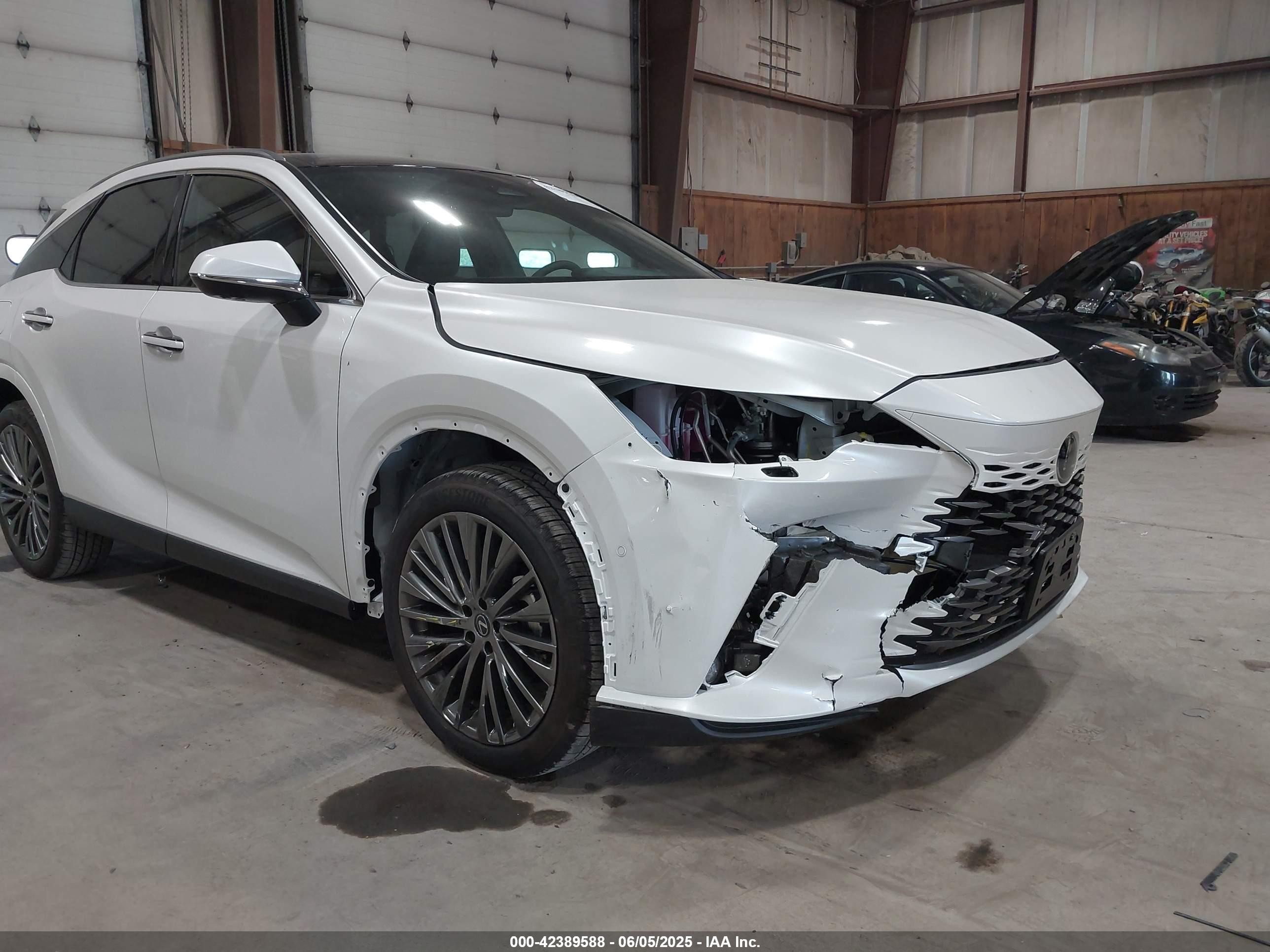 2025 Lexus Rx 450h+ Luxury White vin: JTJCJMGA6S2025585