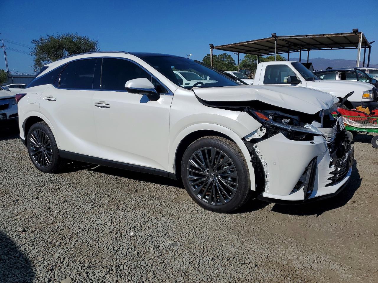 2025 Lexus Rx 450h+ Luxury White vin: JTJCJMGA9S2024690