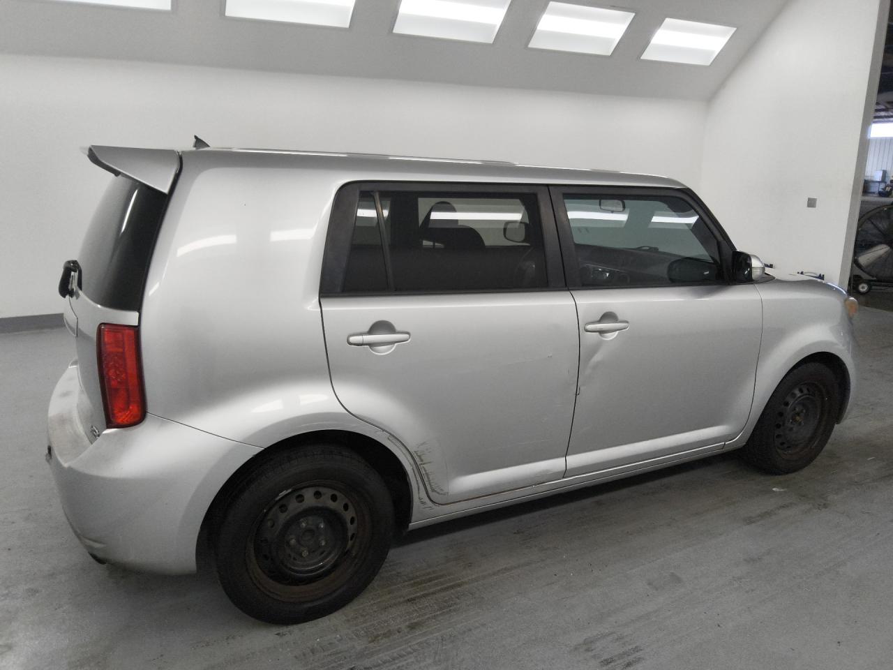 2008 Toyota Scion Xb Silver vin: JTLKE50EX81016963 Damage: Left Rear Wheel Cover, Missing, Replacement Required