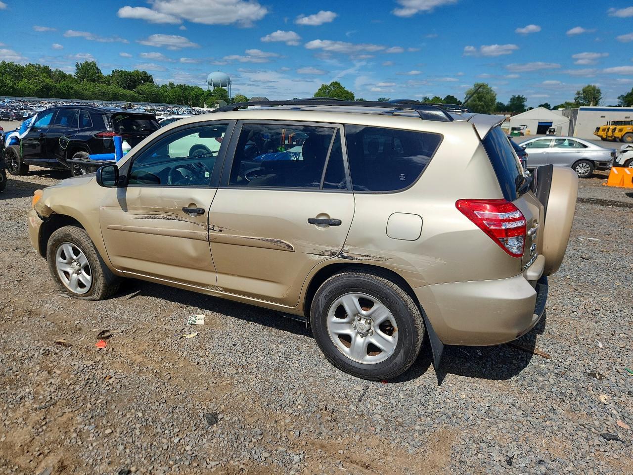 2009 Toyota Rav4 Base Gold vin: JTMBF33V195006390