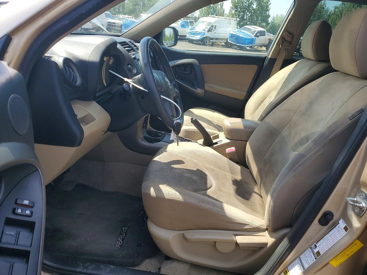 2009 Toyota Rav4 Base Tan vin: JTMBF33V19D014625