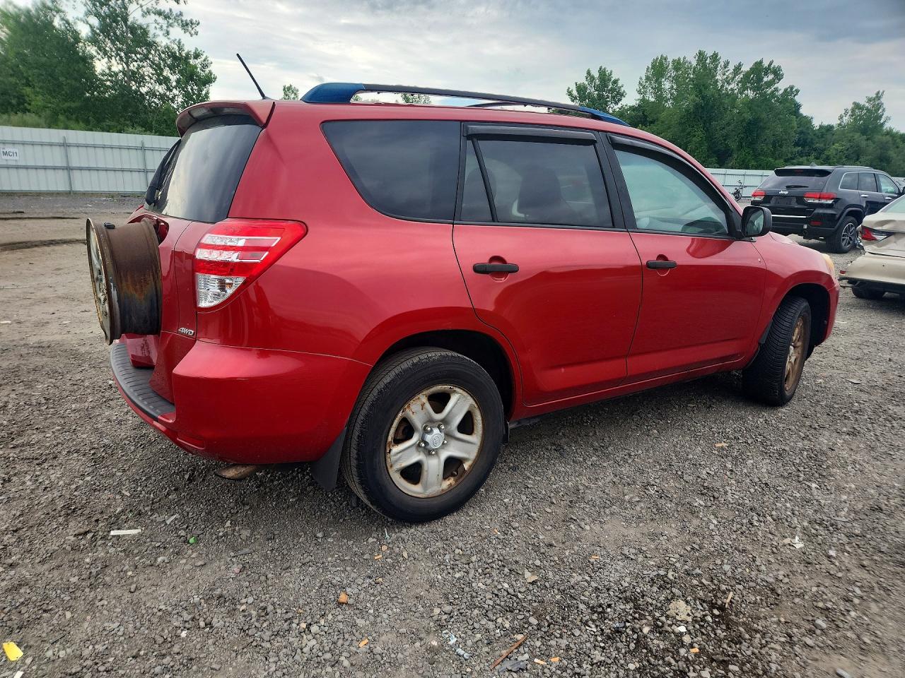 2009 Toyota Rav4 Base Red vin: JTMBF33V595013049