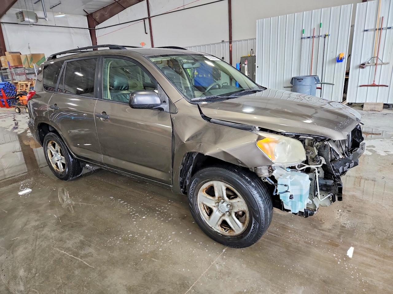 2010 Toyota Rav4 Base Tan vin: JTMBF4DV2AD035007
