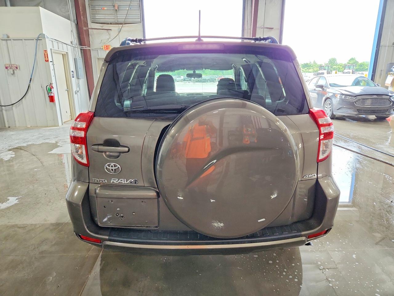 2010 Toyota Rav4 Base Tan vin: JTMBF4DV2AD035007