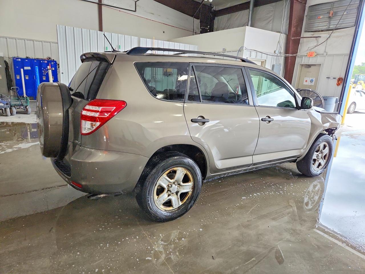 2010 Toyota Rav4 Base Tan vin: JTMBF4DV2AD035007