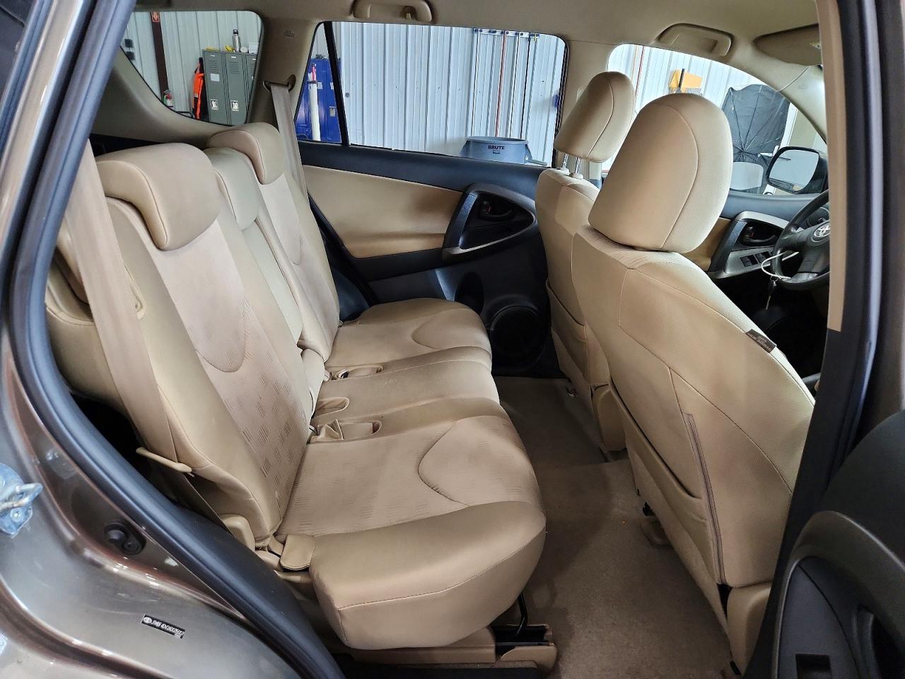 2010 Toyota Rav4 Base Tan vin: JTMBF4DV2AD035007