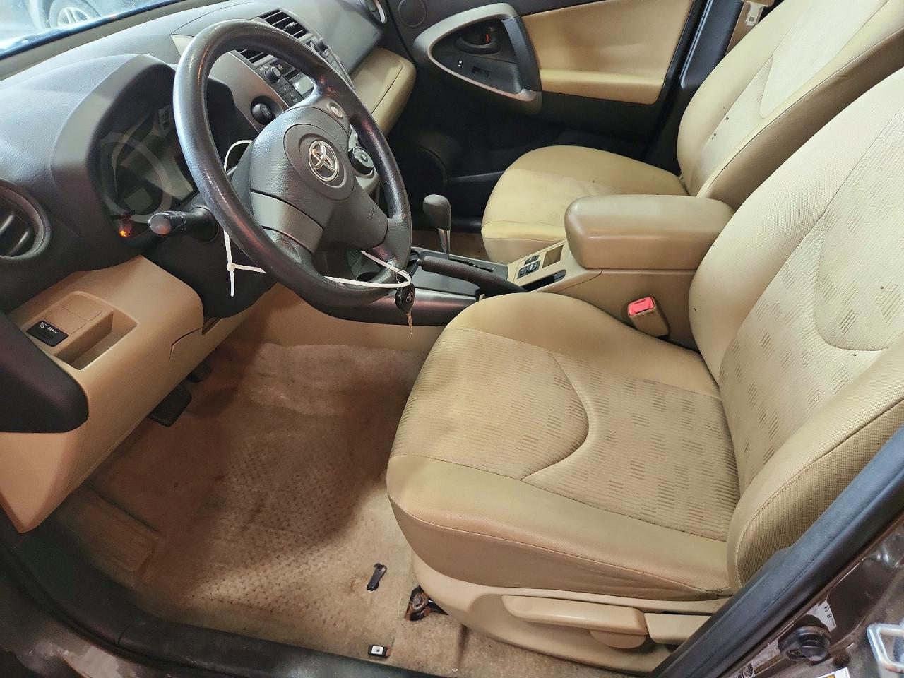2010 Toyota Rav4 Base Tan vin: JTMBF4DV2AD035007