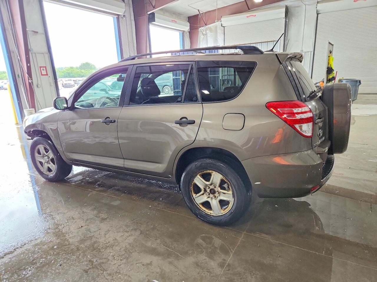 2010 Toyota Rav4 Base Tan vin: JTMBF4DV2AD035007