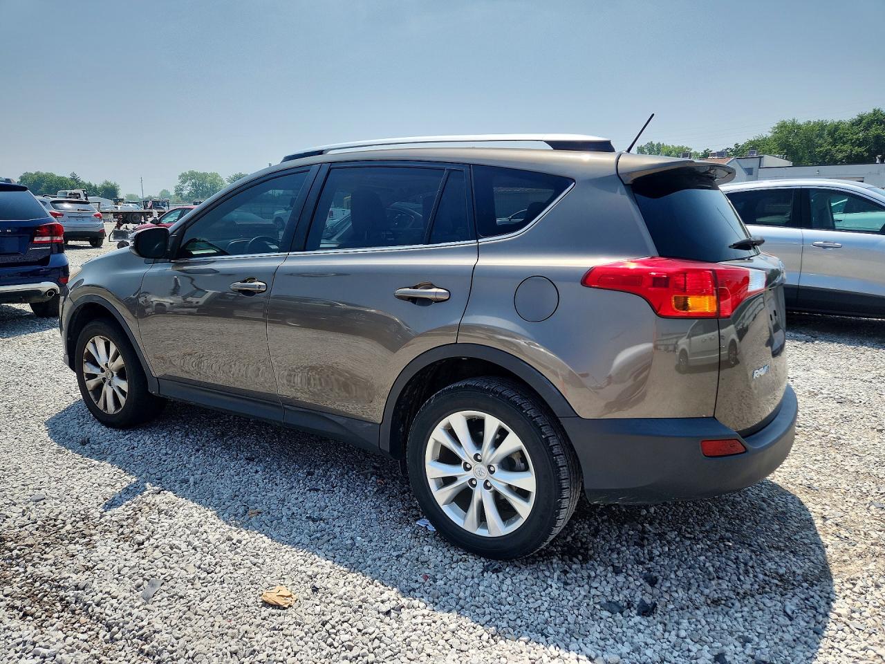 2015 Toyota Rav4 Limited Gold vin: JTMDFREV4FD164197
