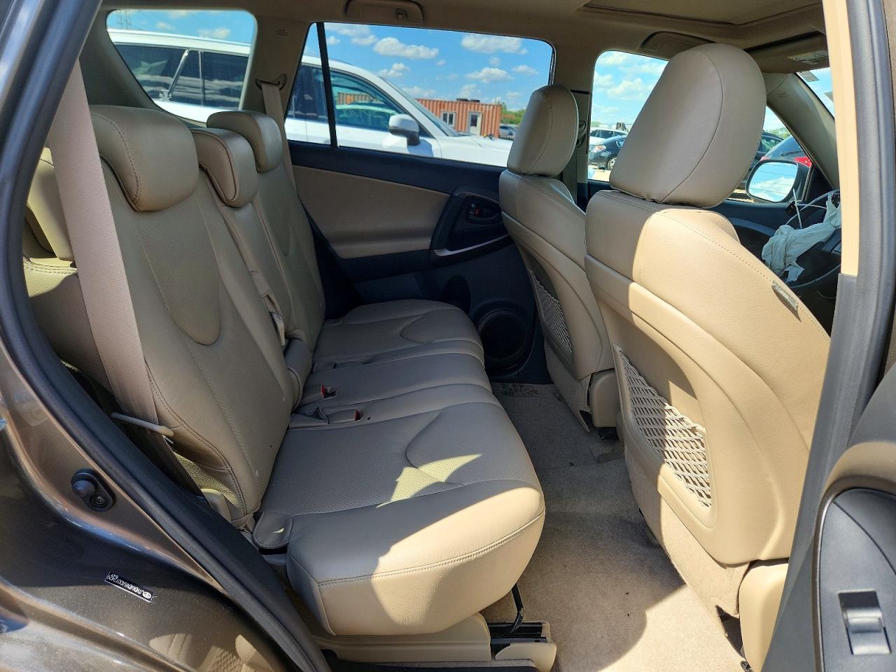 2010 Toyota Rav4 Limited Tan vin: JTMDK4DV6AD012429