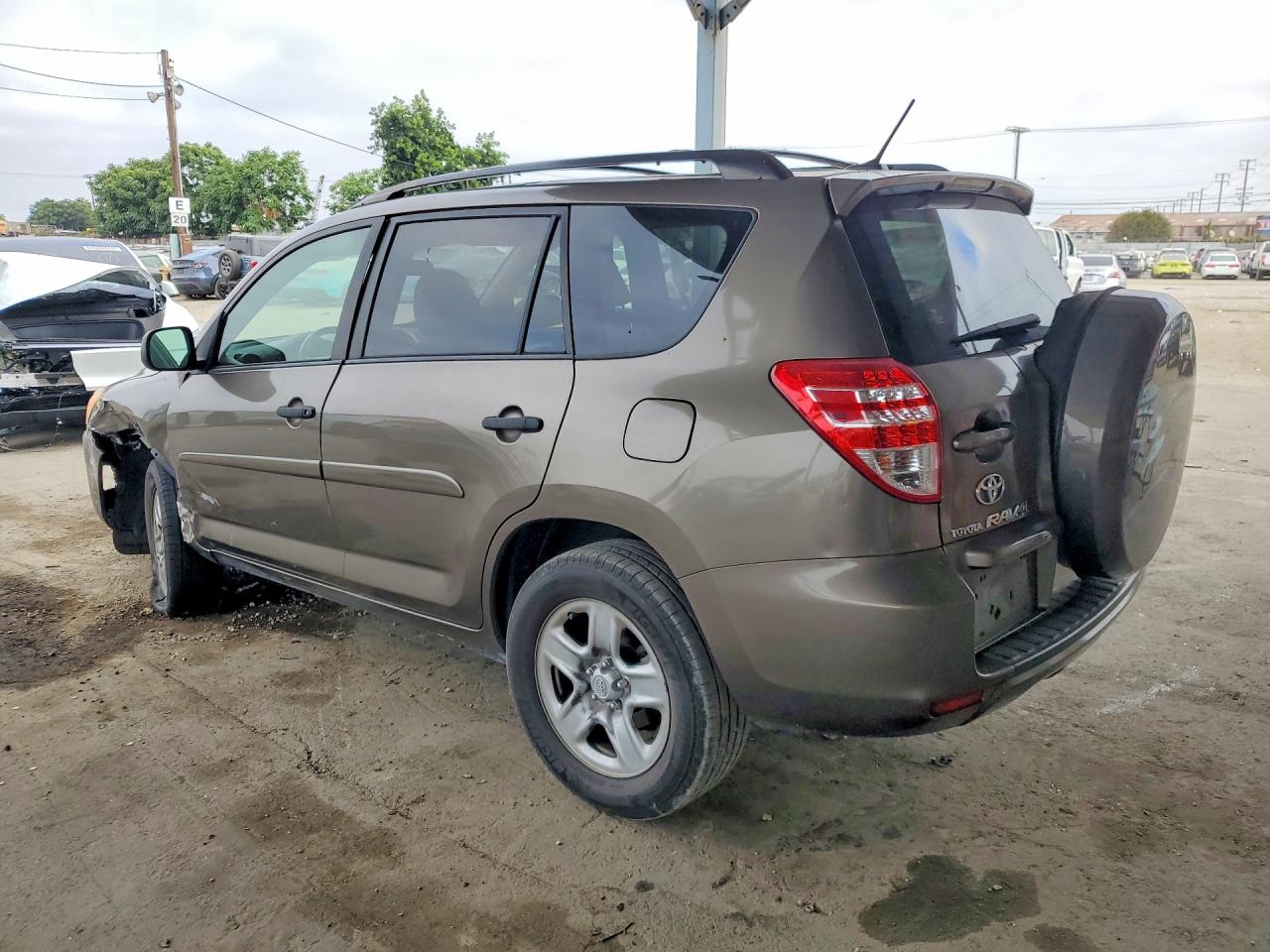 2009 Toyota Rav4 Base Tan vin: JTMZF33V095013460