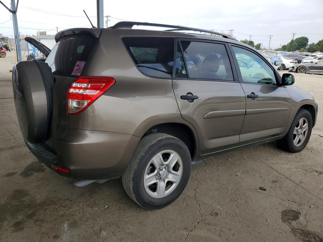 2009 Toyota Rav4 Base Tan vin: JTMZF33V095013460