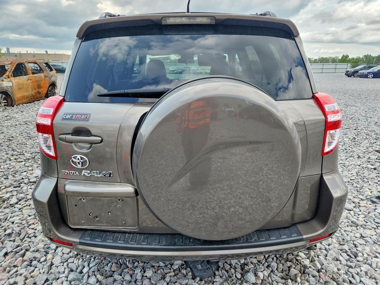 2009 Toyota Rav4 Base Tan vin: JTMZF33V195013418