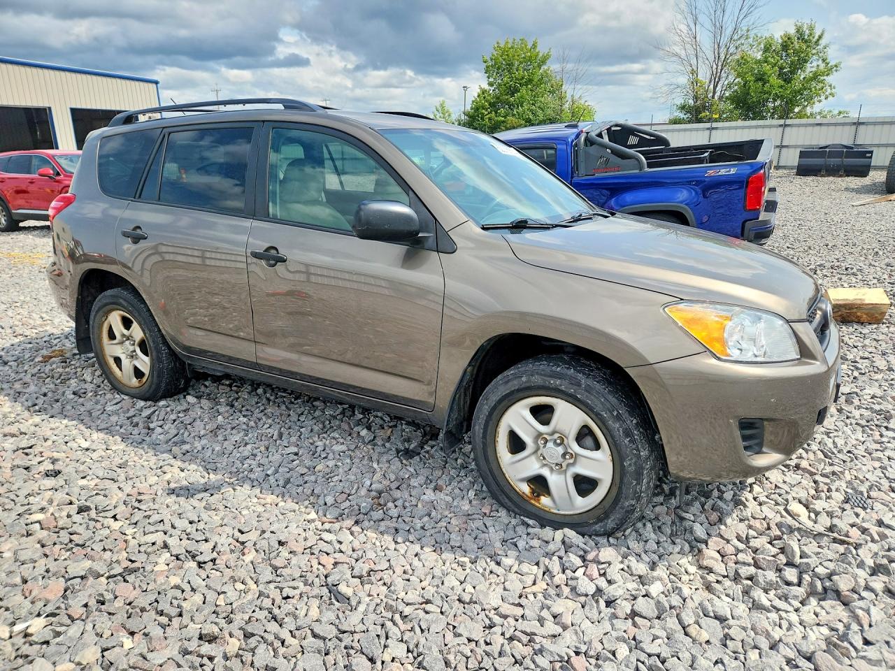 2009 Toyota Rav4 Base Tan vin: JTMZF33V195013418