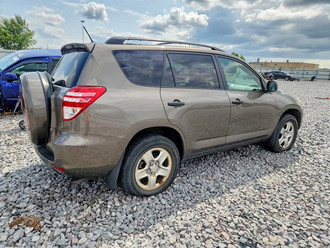 2009 Toyota Rav4 Base Tan vin: JTMZF33V195013418