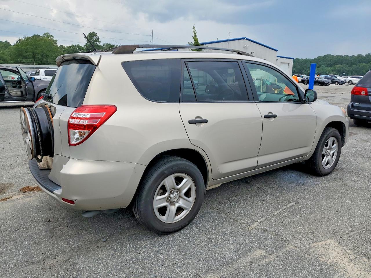 2009 Toyota Rav4 Base Tan vin: JTMZF33V19D004062