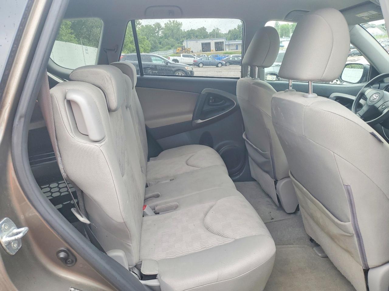 2009 Toyota Rav4 Base Tan vin: JTMZF33V495002171