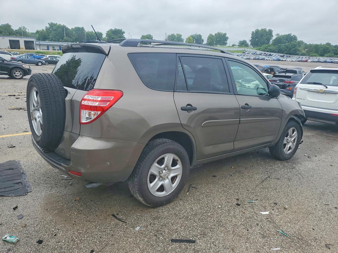 2009 Toyota Rav4 Base Tan vin: JTMZF33V495002171