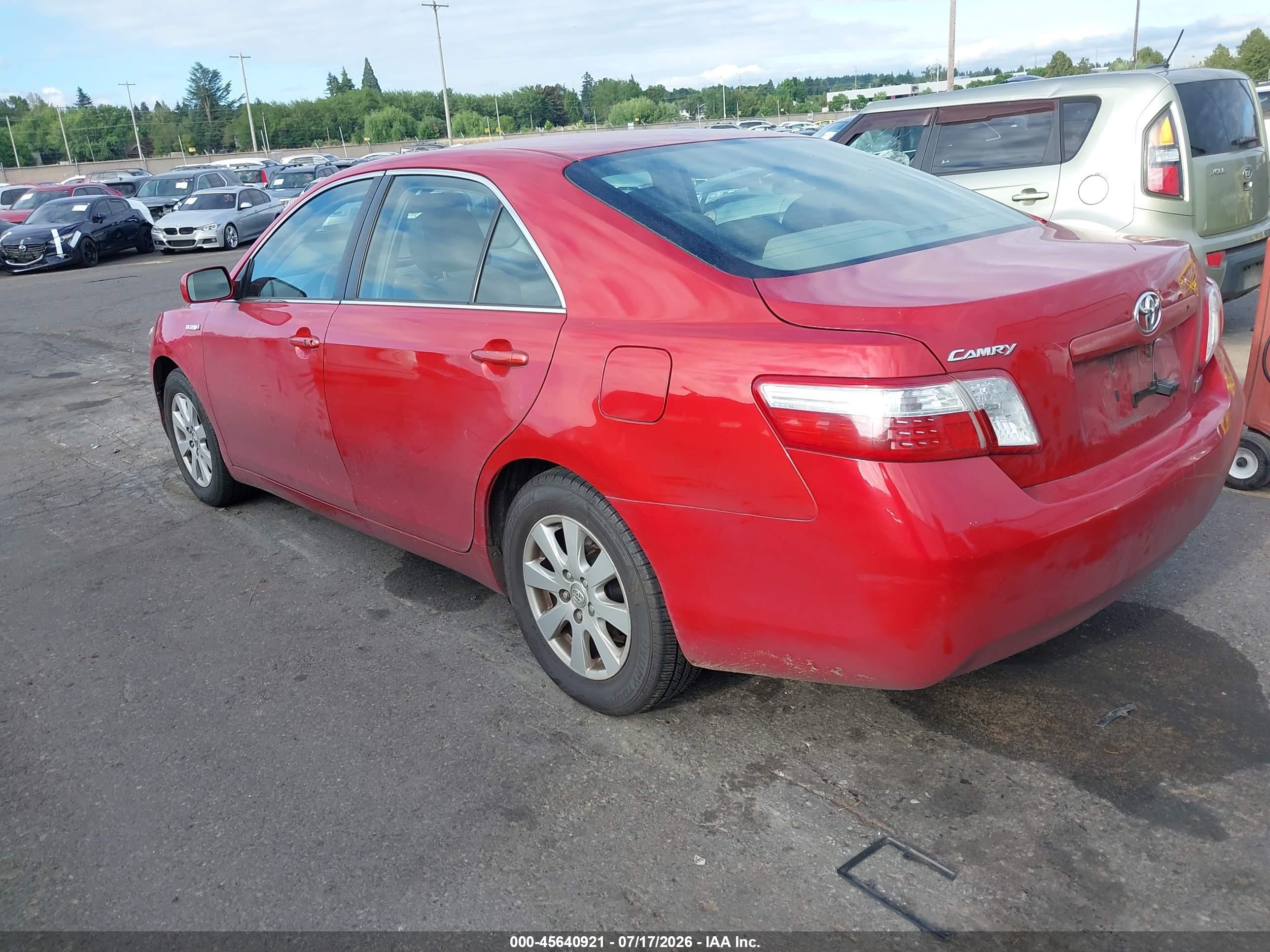 2007 Toyota Camry Hybrid   Red vin: JTNBB46K273014148