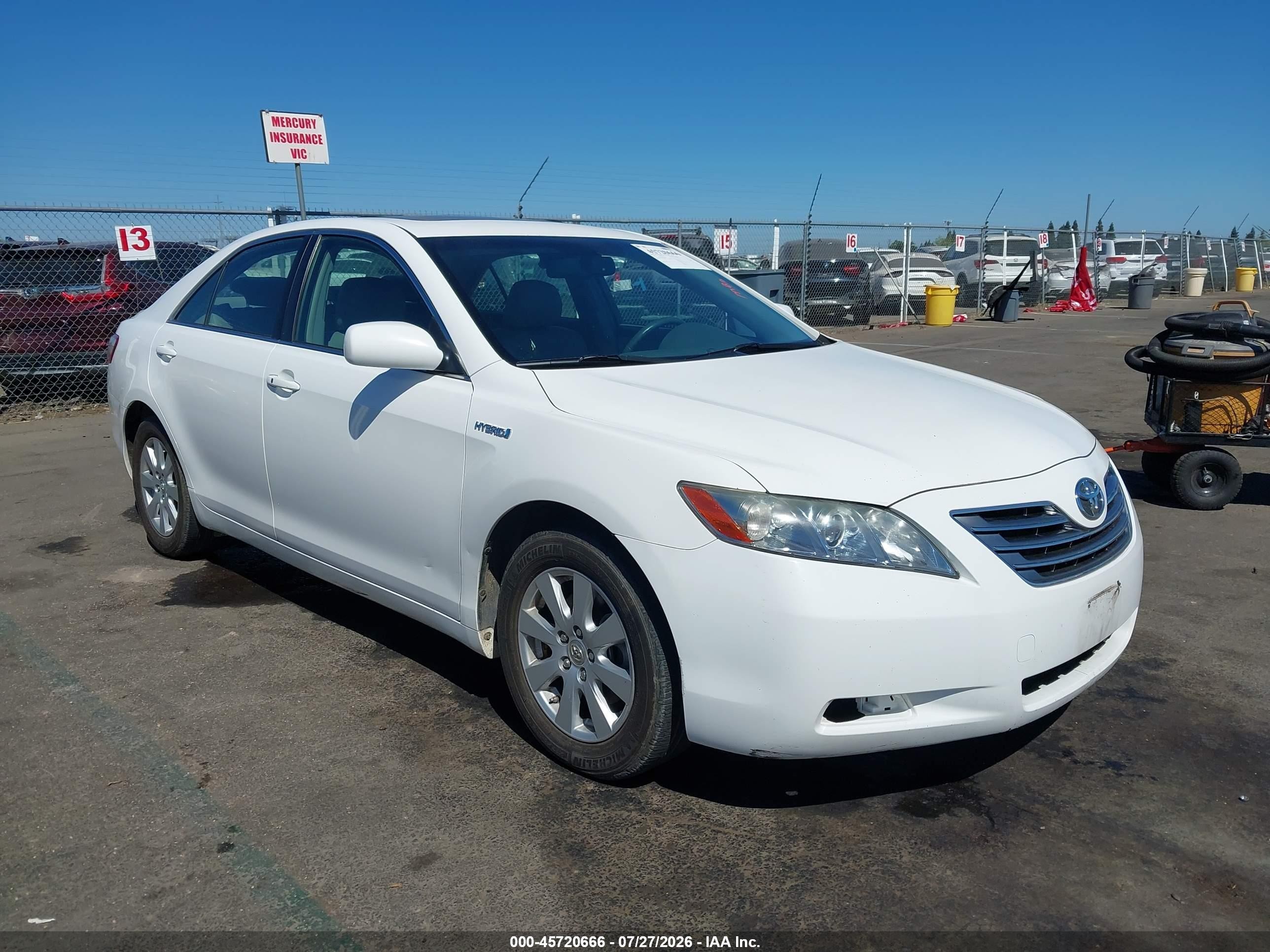 2007 Toyota Camry Hybrid   White vin: JTNBB46K873010217
