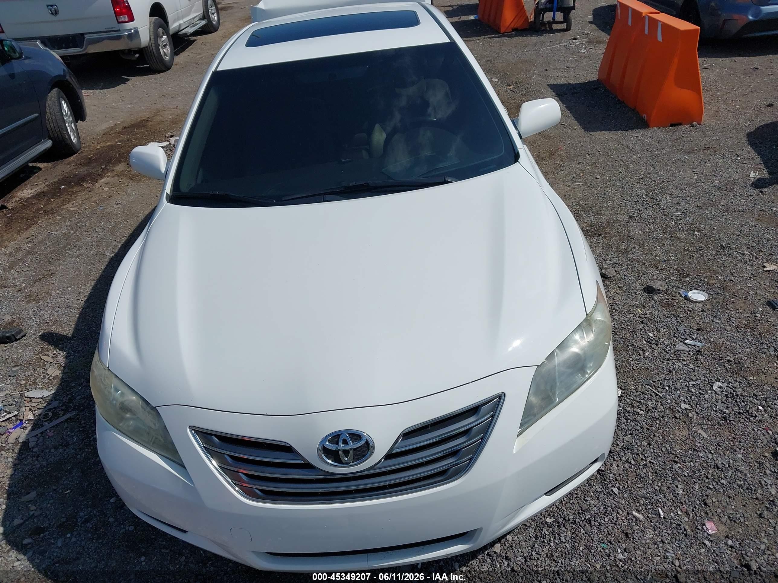 2007 Toyota Camry Hybrid   White vin: JTNBB46K973025454