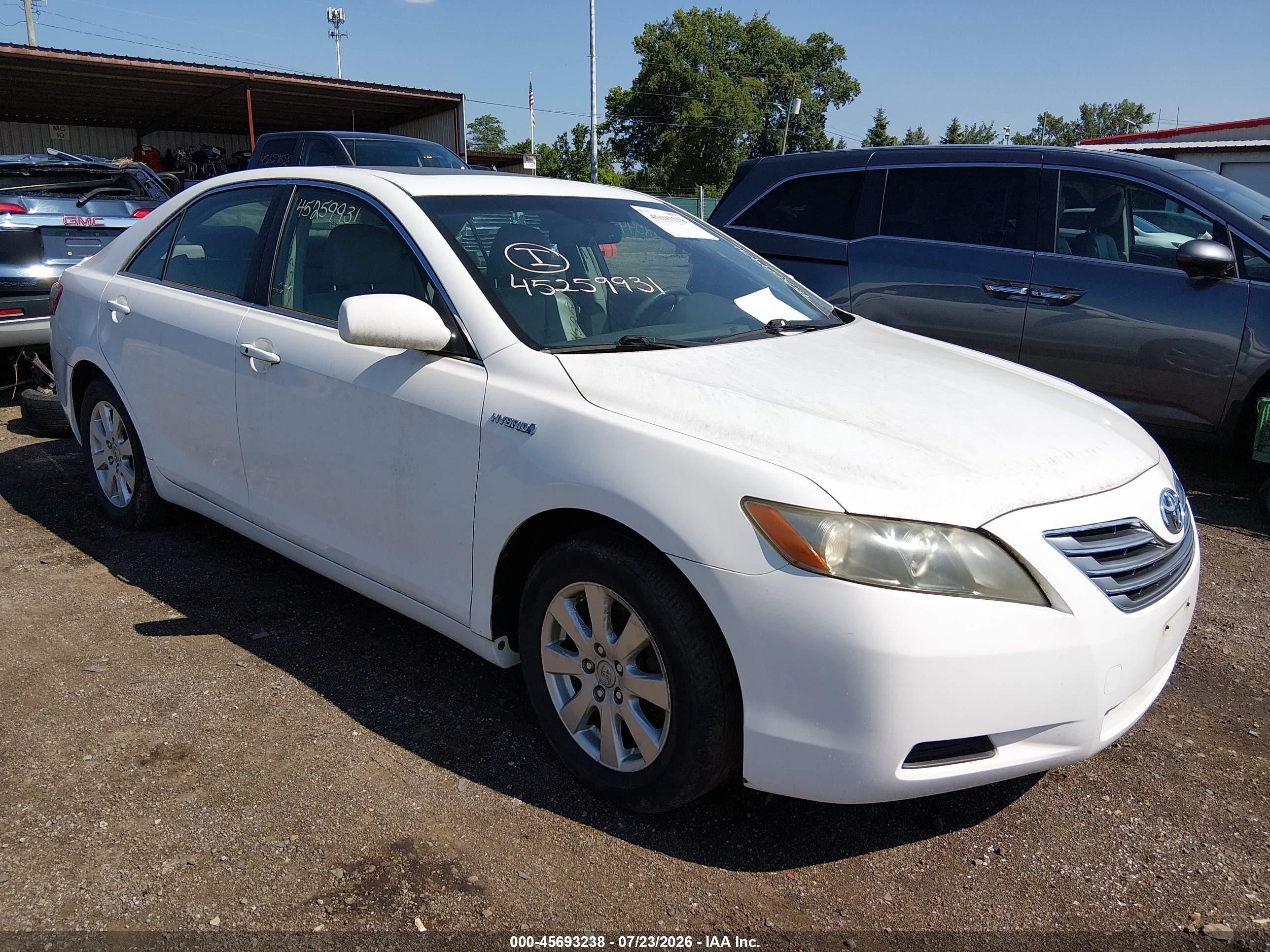 2007 Toyota Camry Hybrid   White vin: JTNBB46KX73009490