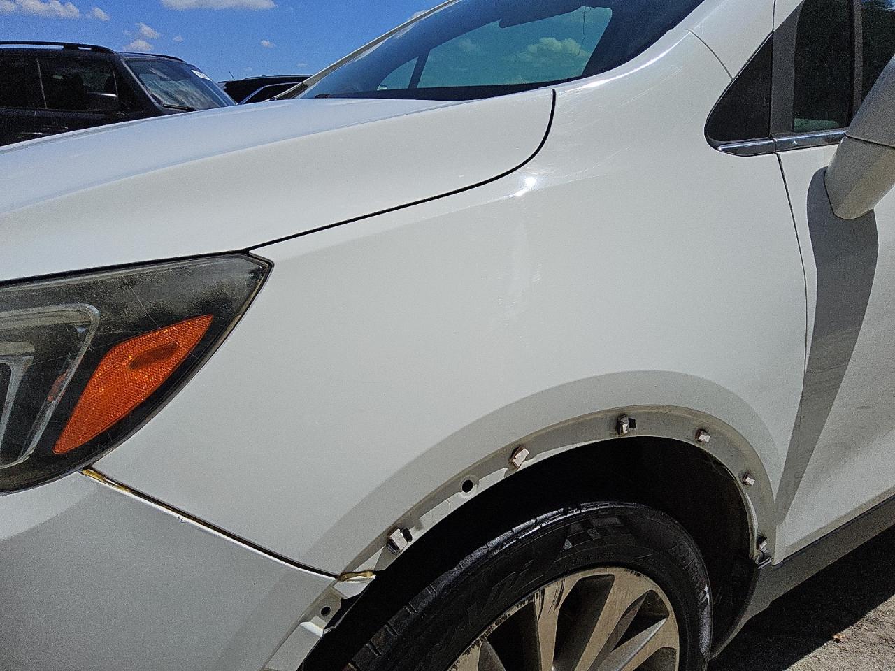 2017 Buick Encore Preferred White vin: KL4CJASB1HB059051 Damage: Left Front Wheel Opening Mldg, Missing, Replacement Required
