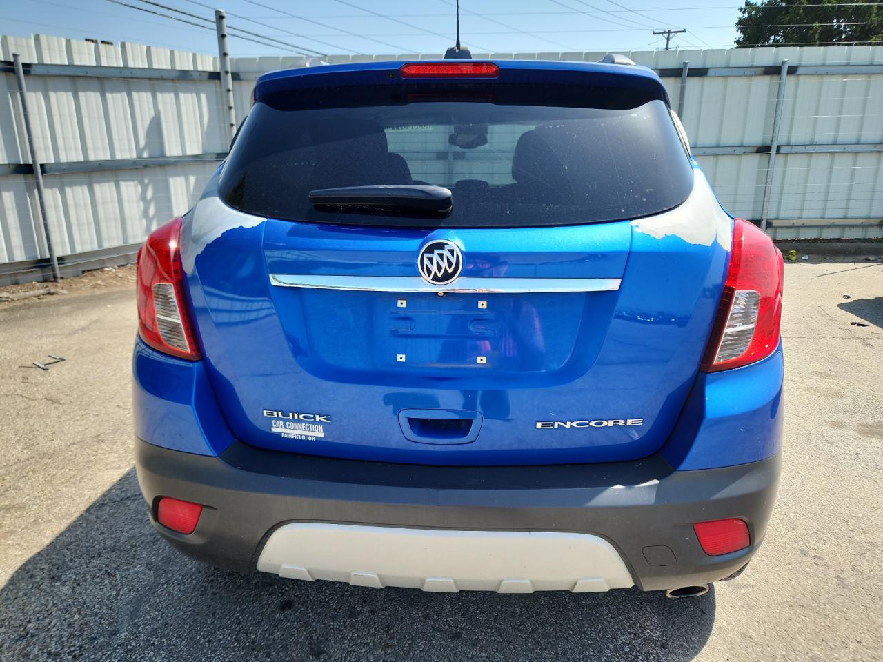 2015 Buick Encore Convenience Blue vin: KL4CJBSB5FB217054 Damage: Lift Gate, Peeling, > 12 Inches