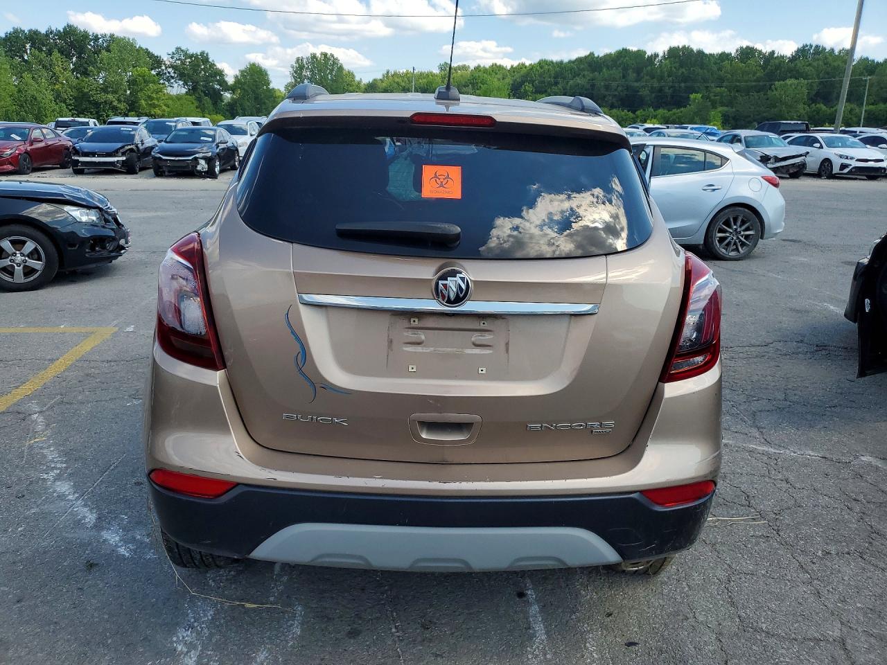 2018 Buick Encore Essence Желто-коричневый vin: KL4CJGSM3JB626225