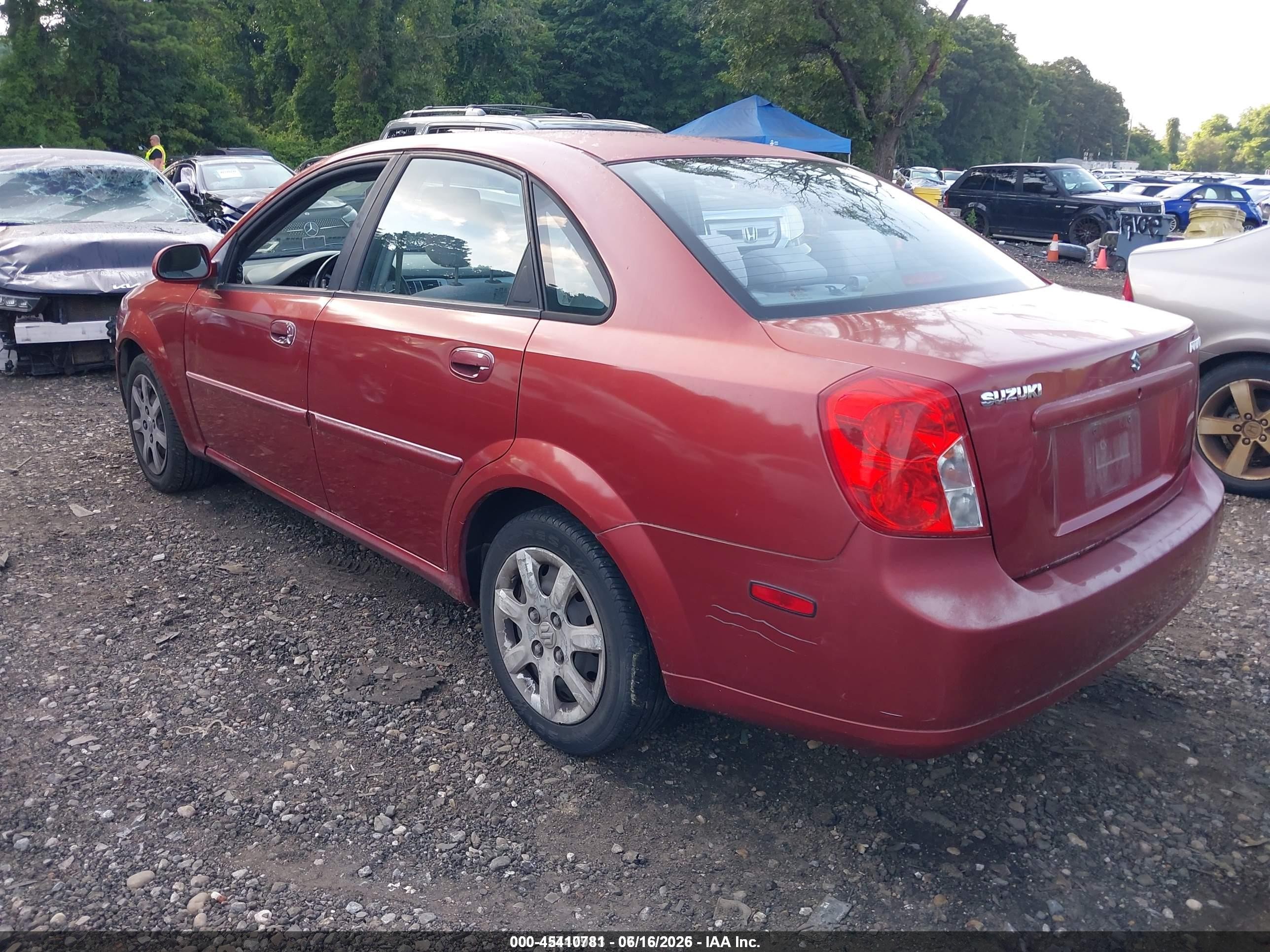 2004 Suzuki Forenza S Red vin: KL5JD52Z14K969999