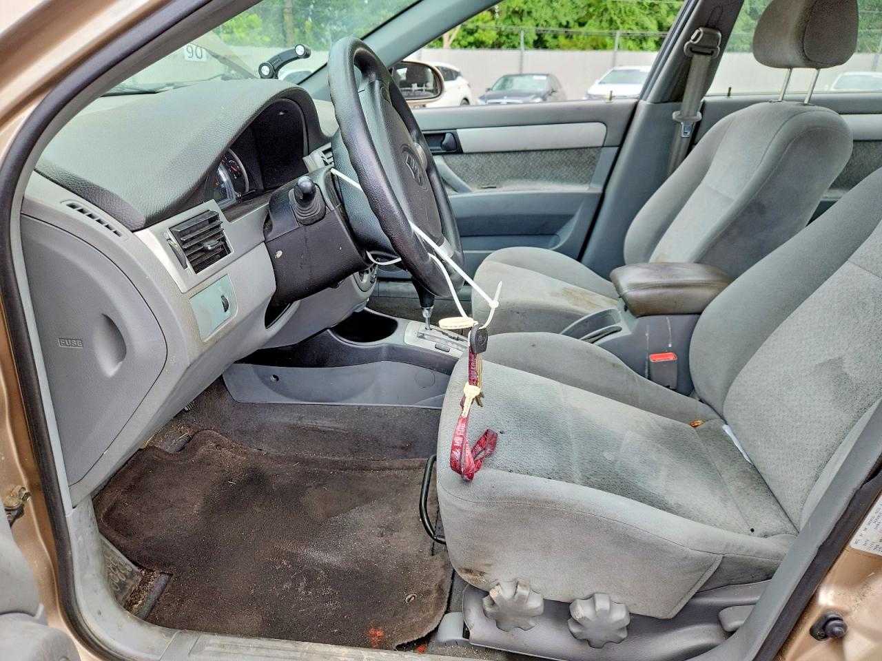 2004 Suzuki Forenza S Tan vin: KL5JD52Z34K946529
