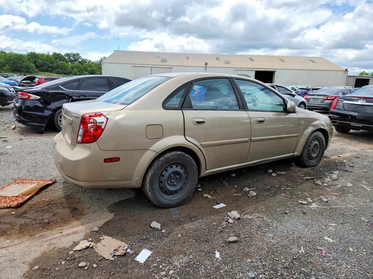 2004 Suzuki Forenza S Tan vin: KL5JD52Z34K946529