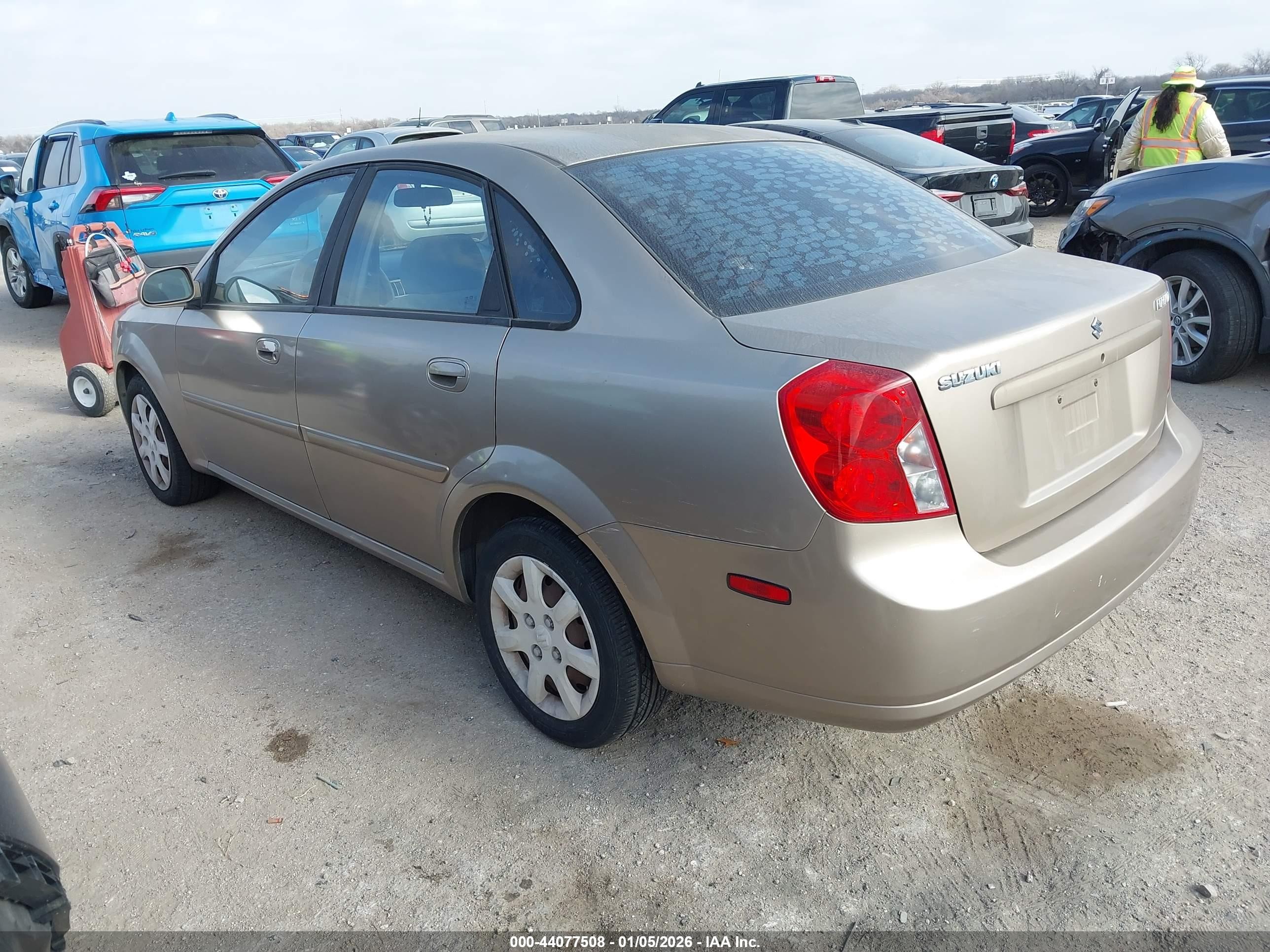 2004 Suzuki Forenza S Gold vin: KL5JD52Z64K953877