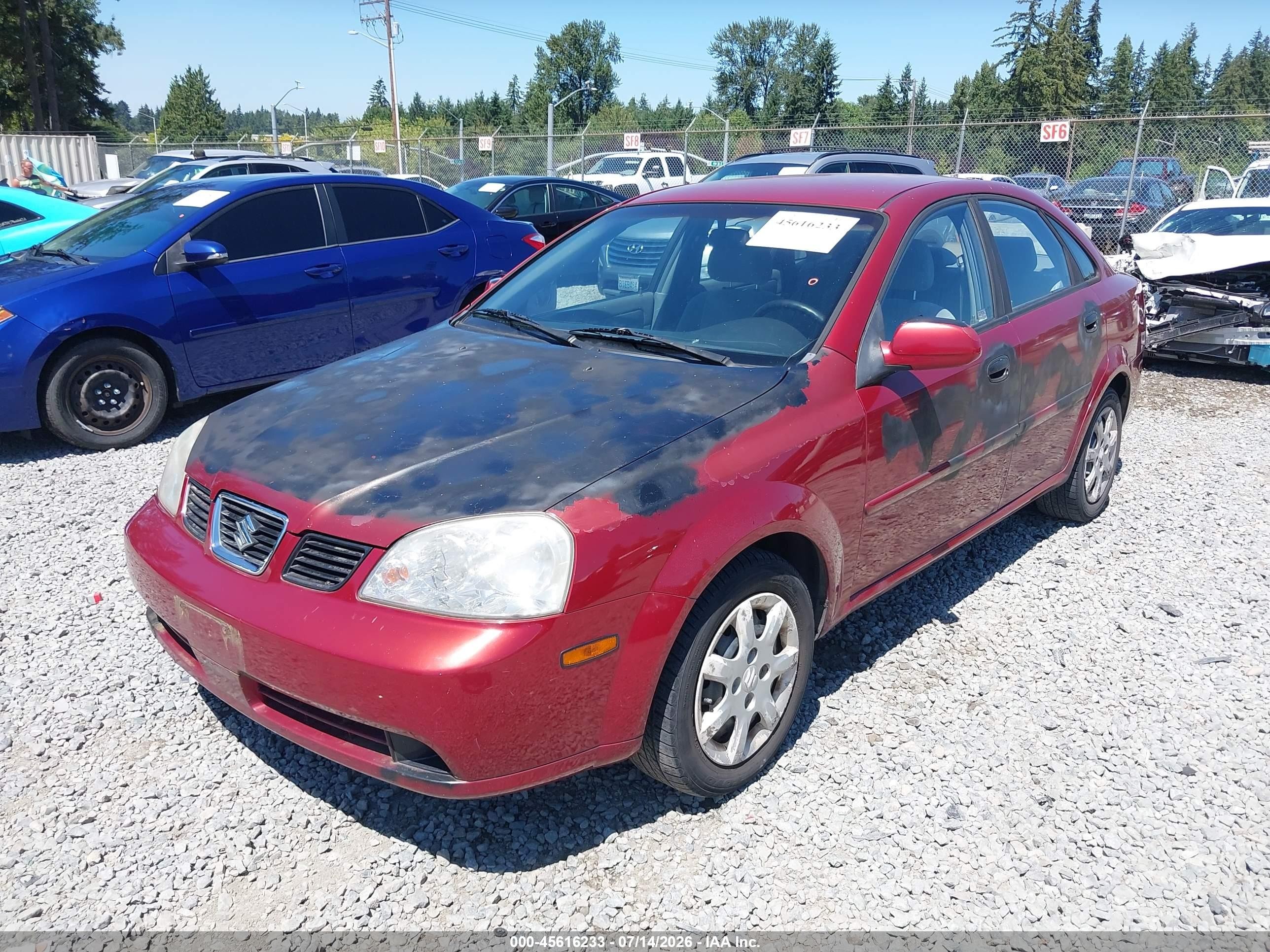 2004 Suzuki Forenza S Red vin: KL5JD52Z64K955001