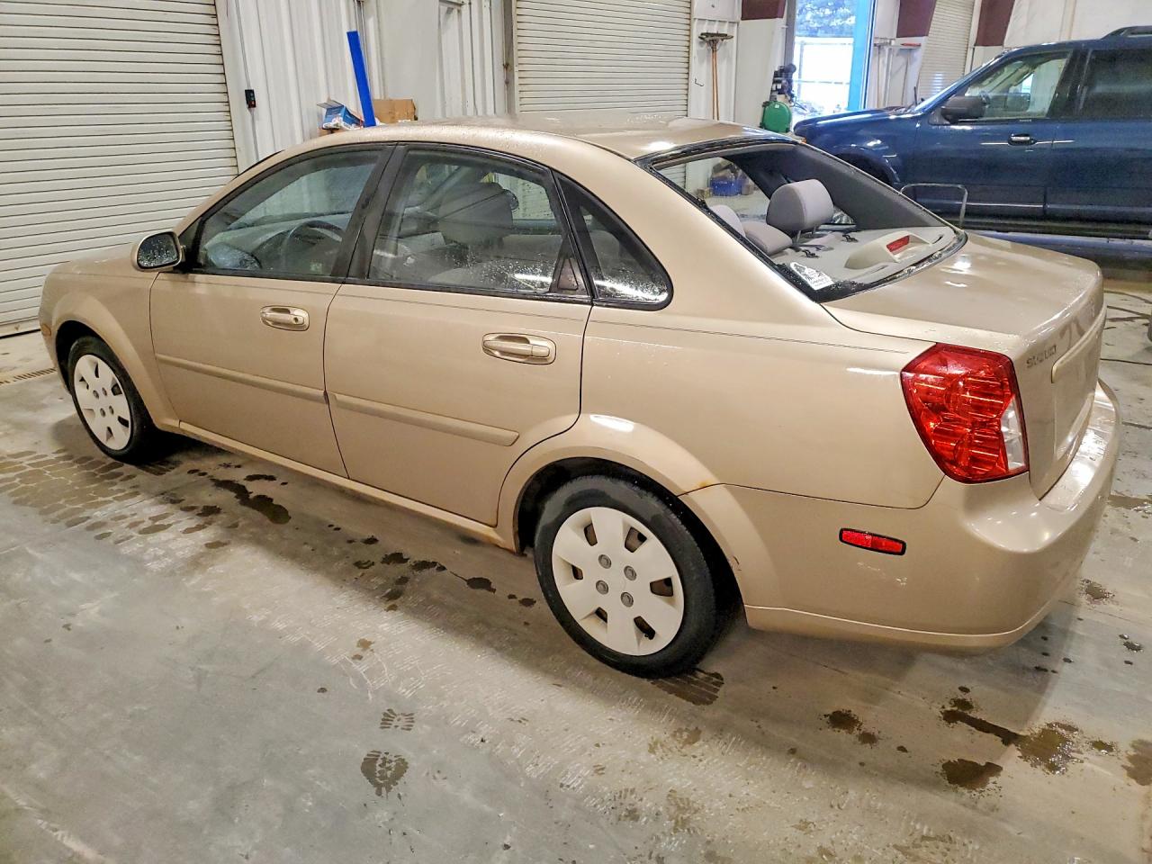 2006 Suzuki Forenza Tan vin: KL5JD56Z66K328022